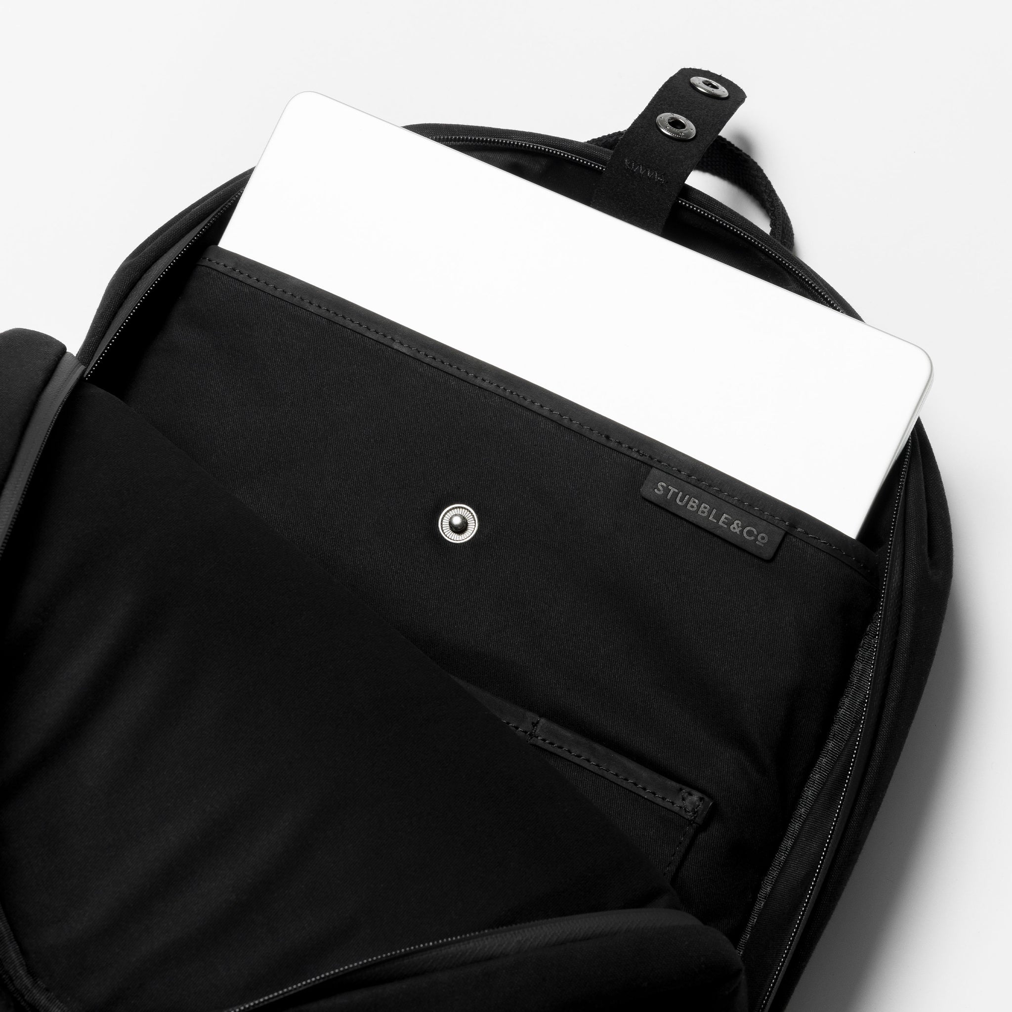 A studio shot of the laptop compartment in  the Classic Backpack 15L in All Black