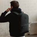 A man wearing a Classic Backpack 15L in Pirate