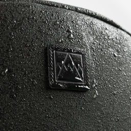 Water-droplets on the Classic Backpack 15L in Pirate showing the water-resistant materials