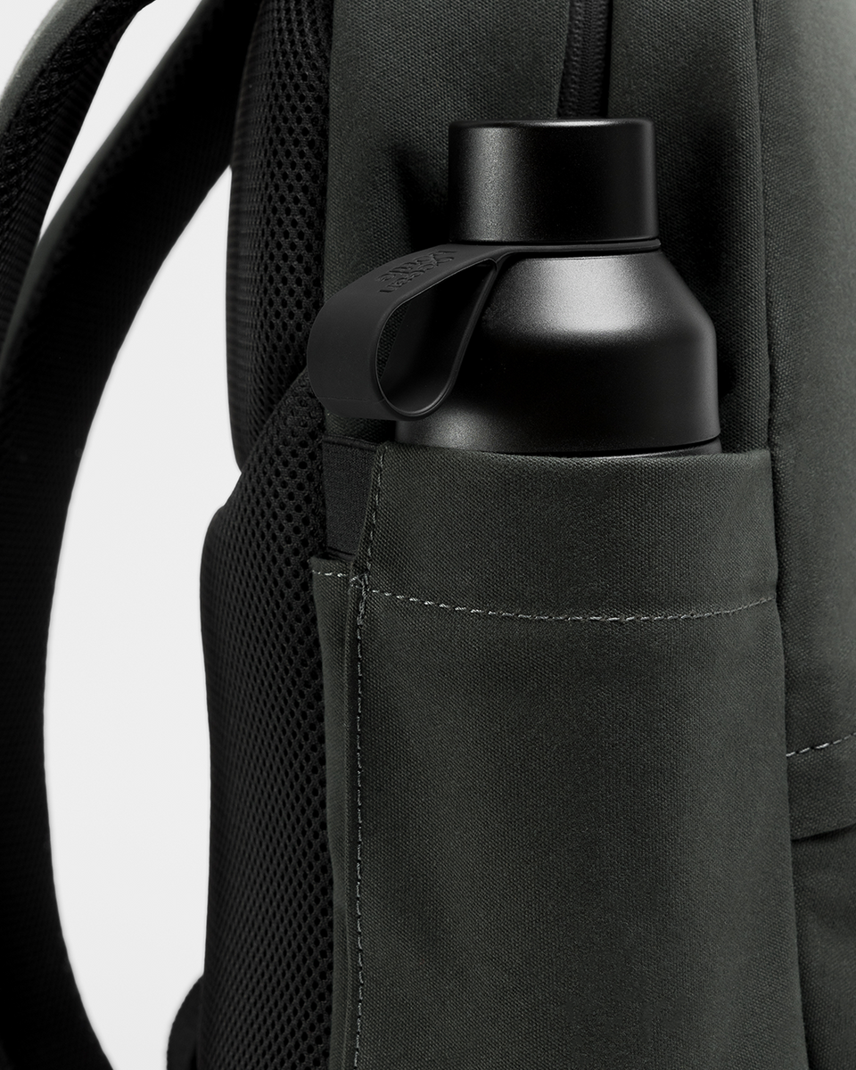 A close up of the bottle pocket on the side of a classic backpack 15l