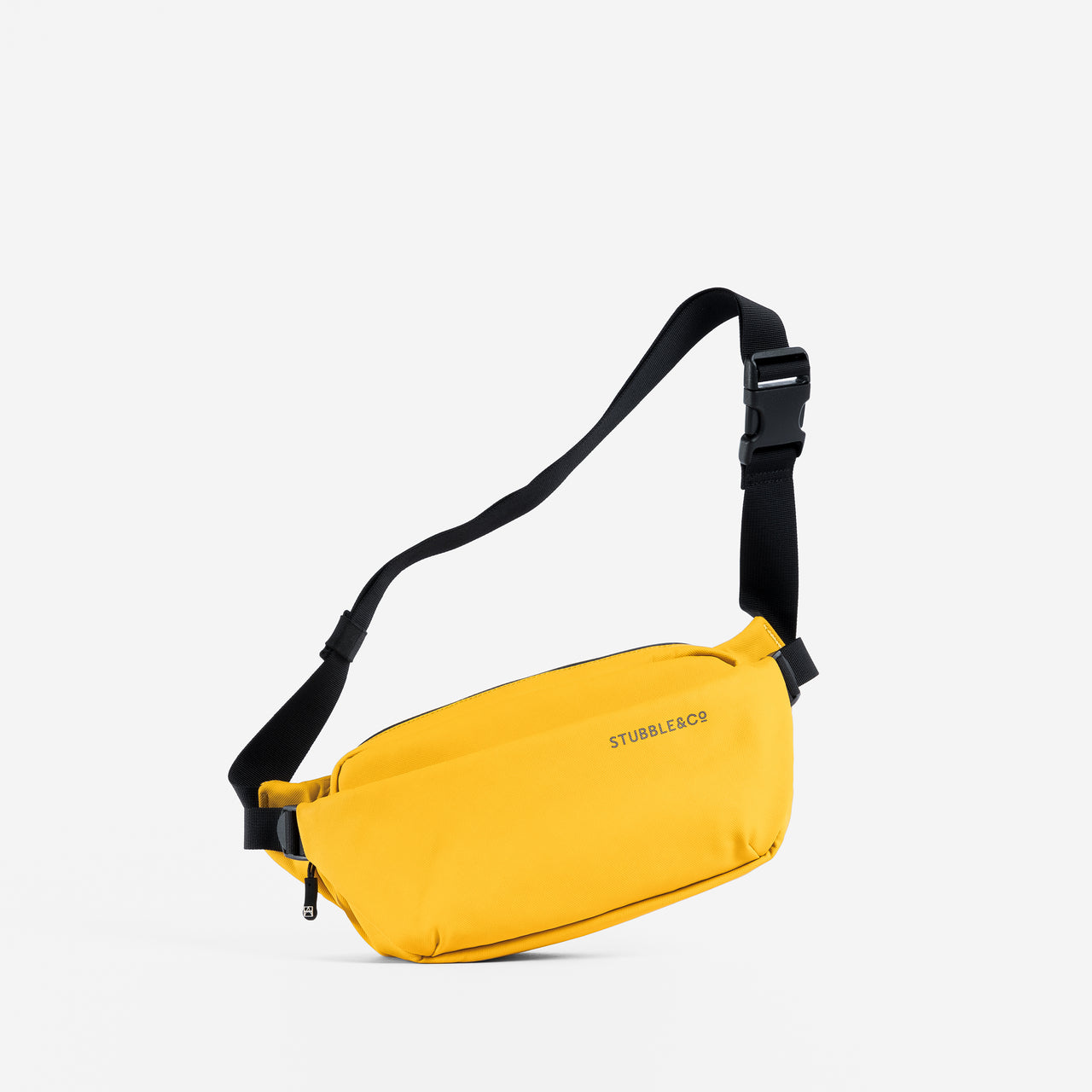 a studio shot of a Yellow crossbody with the adjustable strap 