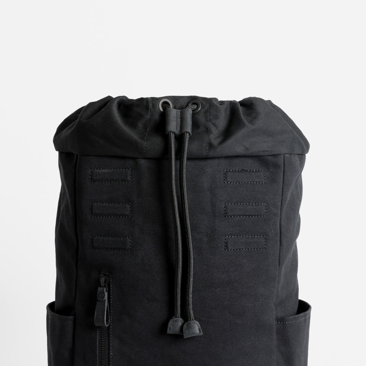 A studio shot of the drawstring in Daypack Outlet in All Black