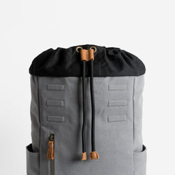 A studio shot of the drawstring in Daypack Outlet in Grey