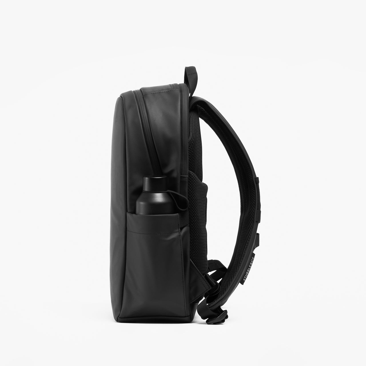 A studio shot of the bottle pocket on the Everyday Backpack 15L in All Black