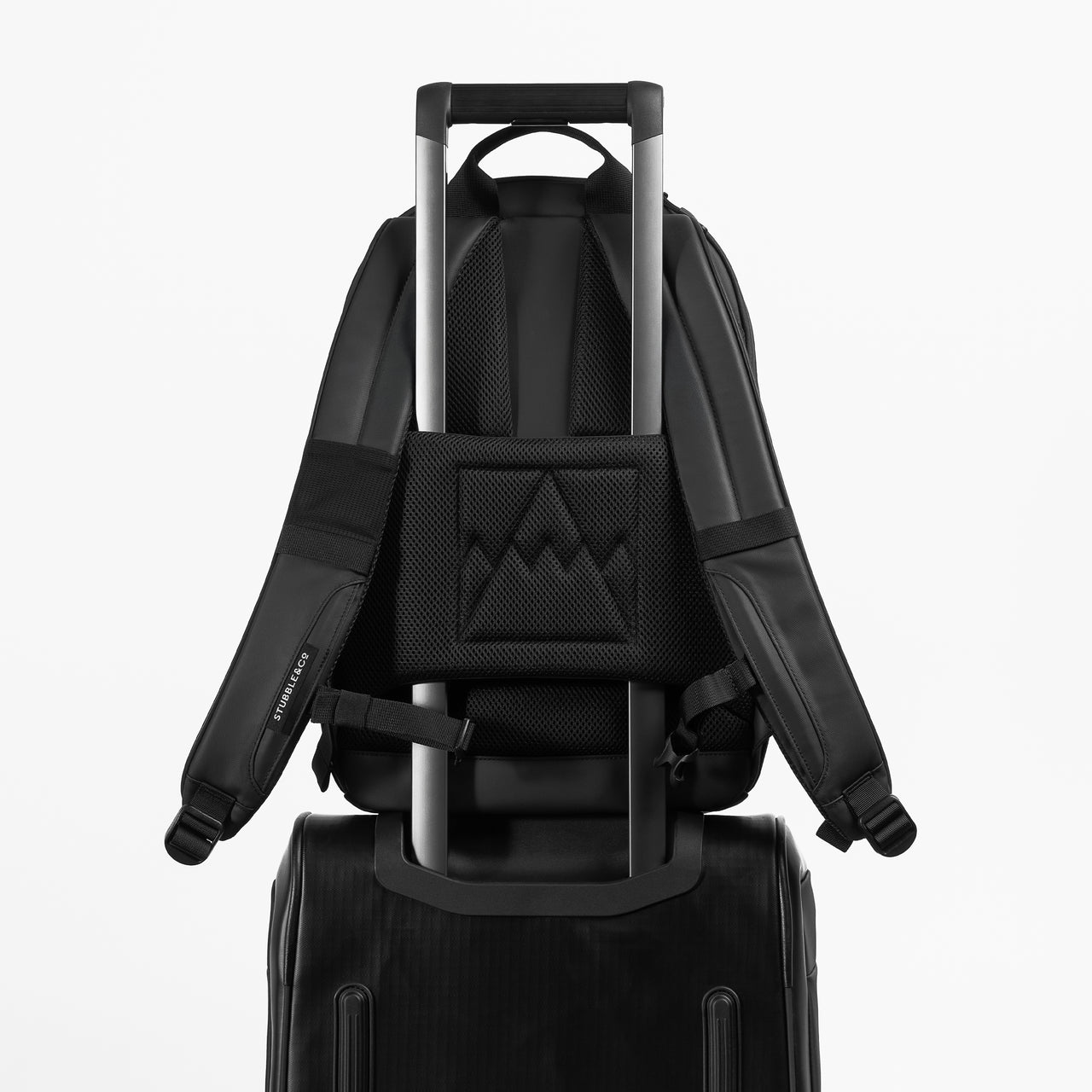 A studio shot of the  trolley sleeve on the Everyday Backpack 15L in All Black