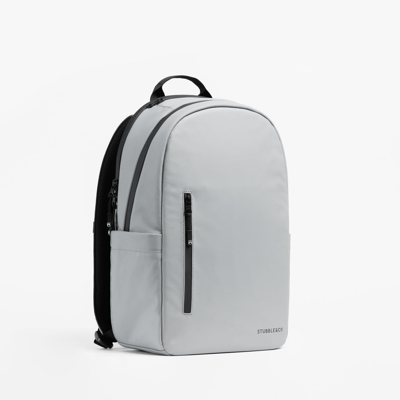 A studio shot of the front and side of the Everyday Backpack 15L in Concrete