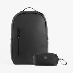 A studio shot of the everyday backpack All Black / All Black wash bag bundle