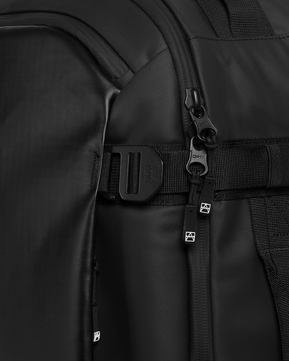 A studio shot of the Hybrid Backpack 30L and its g-hook closure tabs