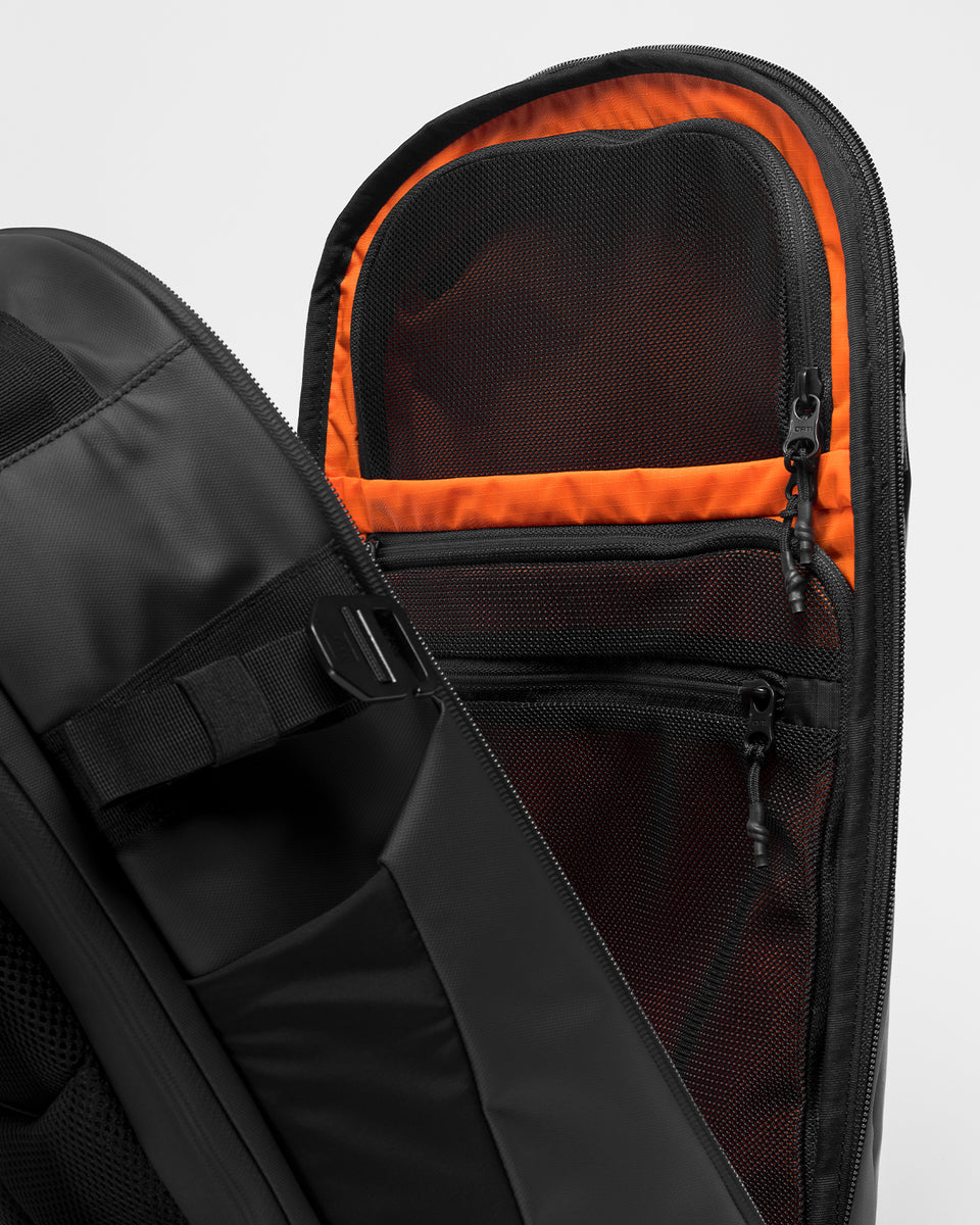 A studio shot of the Hybrid Backpack 30L and its internal pockets for organisation