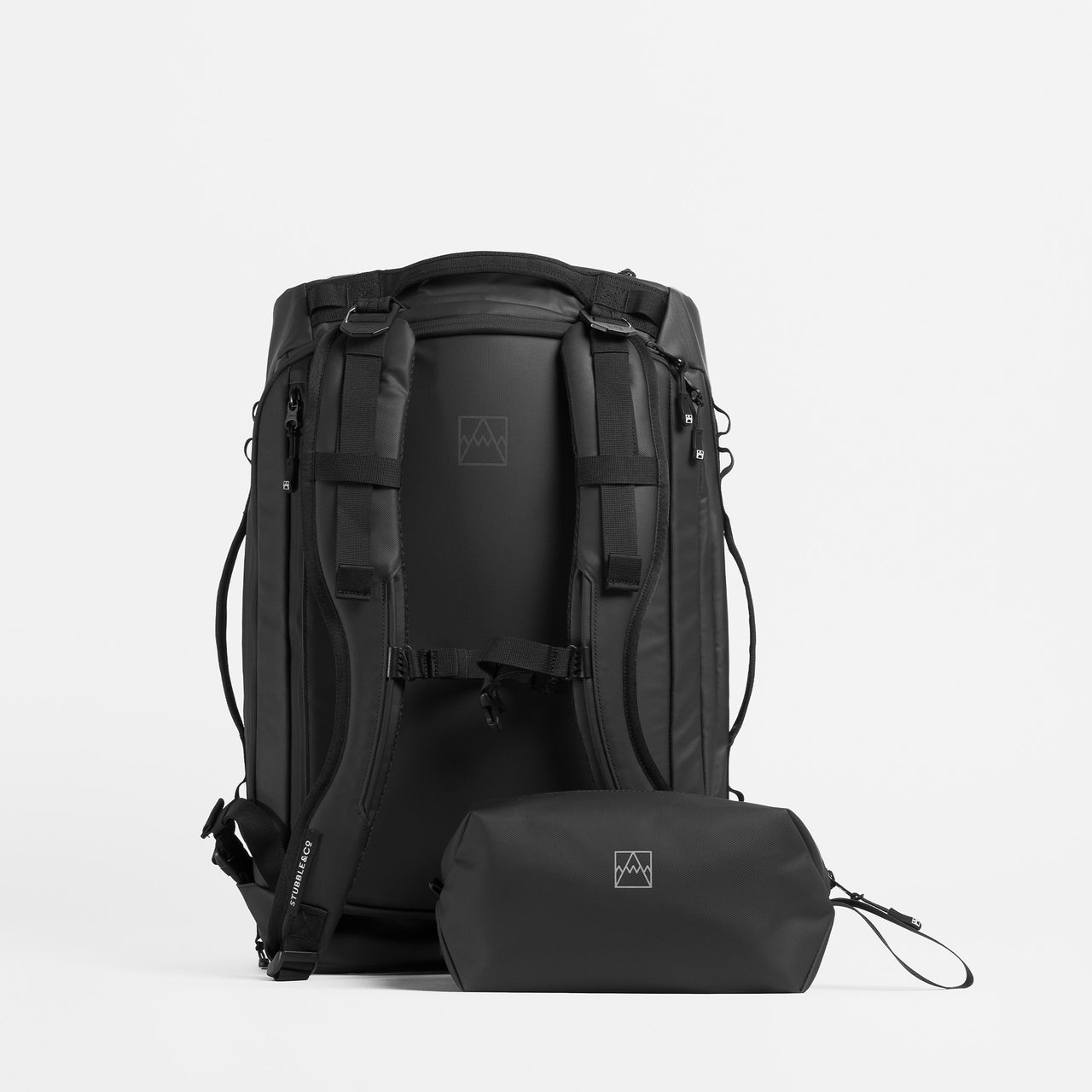 a studio shot of Kit Bag 30L and wash bag in All Black