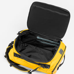 A studio shot of the interior compartment in the Kit Bag 30L in Yellow