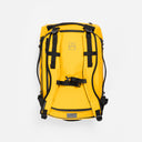 A studio shot of the chest straps and back panel on the Kit Bag 30L in Yellow