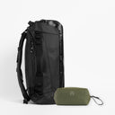 A studio shot of the Kit Bag 40L All Black / Urban Green Wash Bag bundle