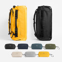 A studio shot of the Kit Bag 65L in yellow and all black with the wash bag all colour bundle [All variants]