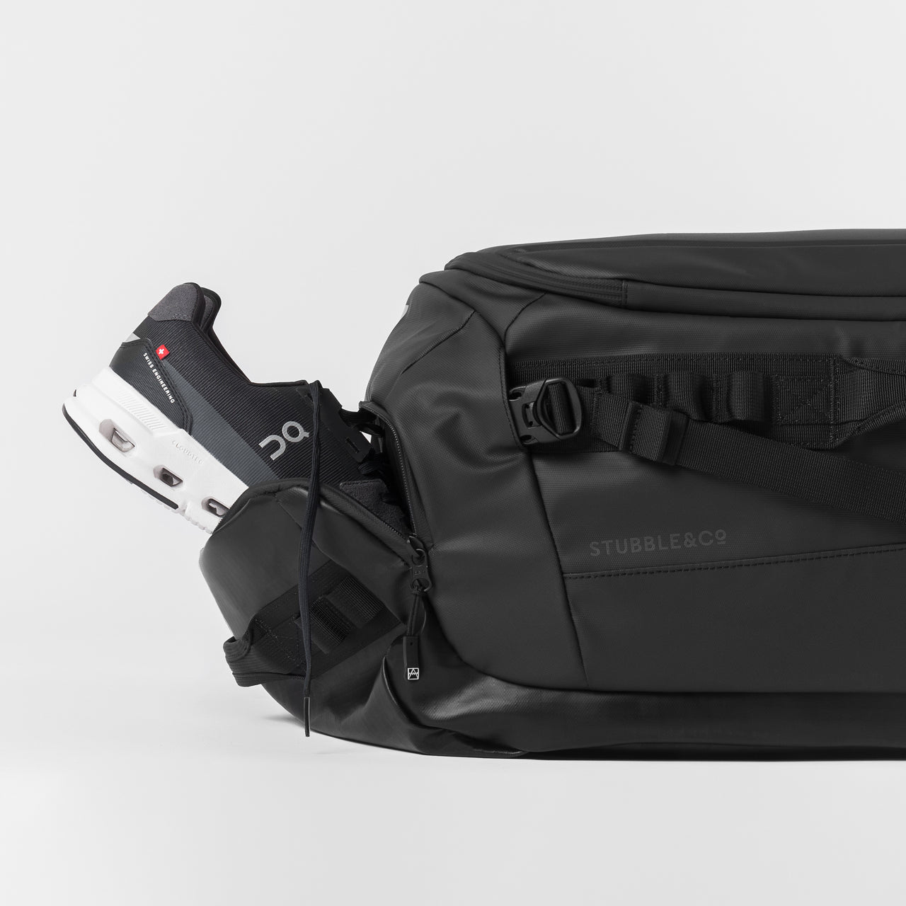 A studio shot of the shoe compartment of a kit bag 65l [All variants]