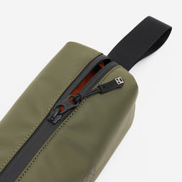 A studio shot of the close up of the zip on the pencil case in Urban Green