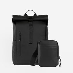 A studio shot of a Roll Top 20L and a Shoulder Bag in All Black / All Black