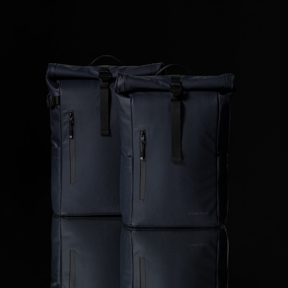 A Studio shot of the Roll Top in 20L and  15L side by side in Midnight Blue