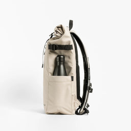 Side view of The Roll Top 20L backpack in Sand