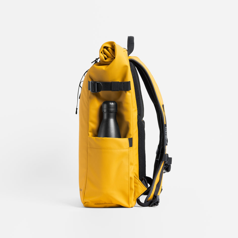 a studio shot of the side bottle pocket on a Yellow roll top 20l