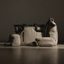 A studio shot of the Sand collection of Stubble and Co bags and backpacks, including a Sand Tote Bag