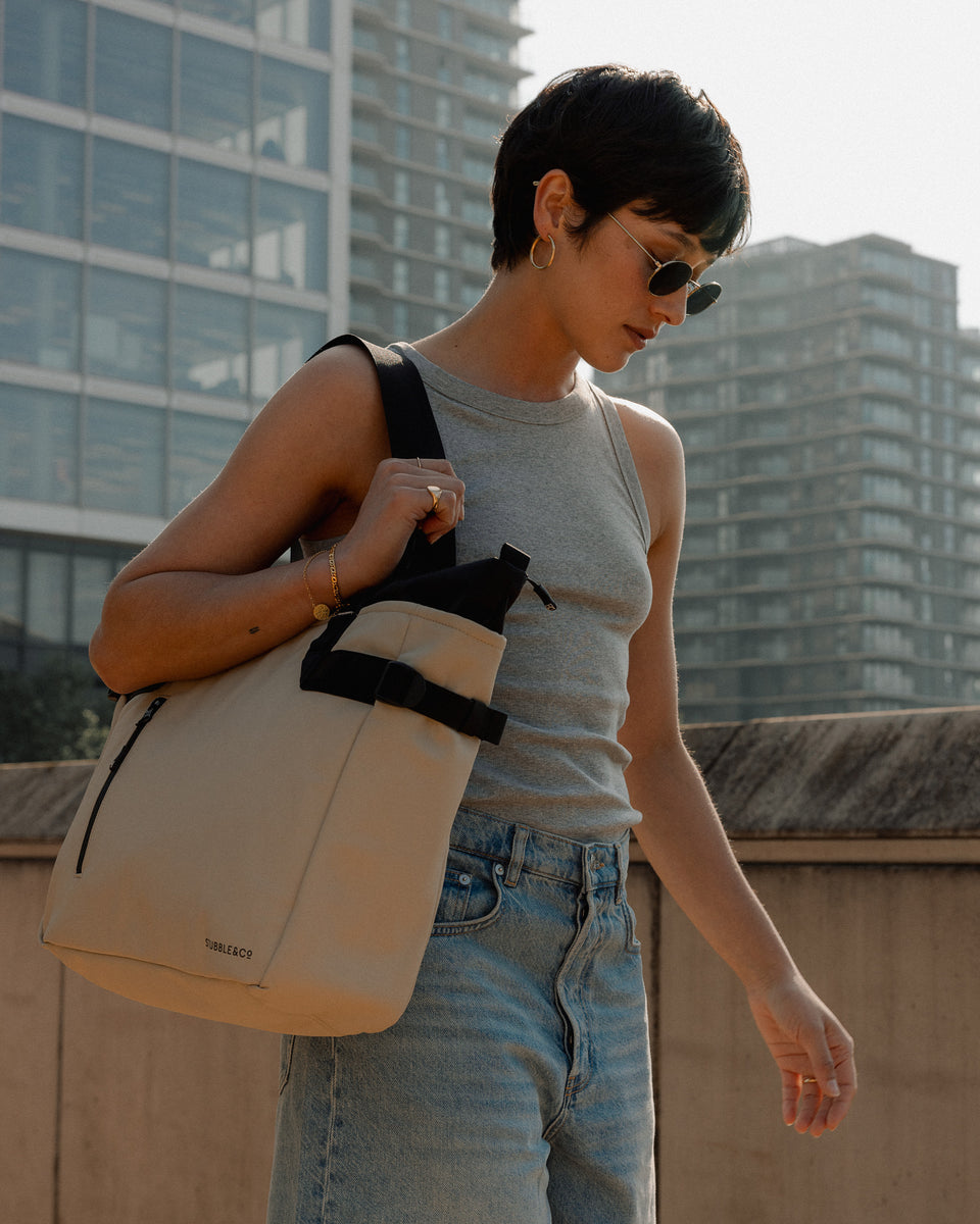 women with sand coloured tote bag