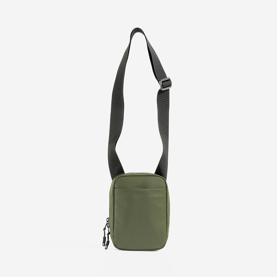 A studio shot of the long strap on an Urban Green shoulder bag