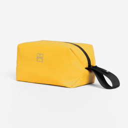 A studio shot of the Yellow Wash Bag with the logo visible